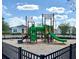 Community playground with slides, climbing structures, and a safe, fenced area, providing a fun space for children at 3579 Sweet Mabolo St, Wesley Chapel, FL 33543