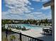 Community pool featuring lounge chairs, tables, and a pergola, perfect for relaxation and social gatherings at 3579 Sweet Mabolo St, Wesley Chapel, FL 33543