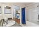 Bathroom featuring a vanity with granite countertops, sink, and bathtub with shower at 3638 Trafalgar Way # 103, Palm Harbor, FL 34685