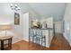 Kitchen with bar seating features modern appliances and a view to the home entrance at 3638 Trafalgar Way # 103, Palm Harbor, FL 34685