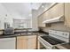 Well-lit kitchen with ample counter space, modern appliances, and an open layout, ideal for cooking and socializing at 3638 Trafalgar Way # 103, Palm Harbor, FL 34685