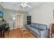 Relaxing living room featuring a comfortable couch, piano, and stylish coffee table at 3638 Trafalgar Way # 103, Palm Harbor, FL 34685