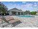Beautiful community pool area complete with lounge chairs and shaded pavilion at 3638 Trafalgar Way # 103, Palm Harbor, FL 34685