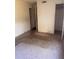 Bedroom in need of repair with dirty carpet and access to hallways at 4215 E Bay Dr # 1701B, Clearwater, FL 33764