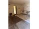 Kitchen in need of repair with missing cabinets and damaged walls at 4215 E Bay Dr # 1701B, Clearwater, FL 33764