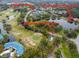 An aerial view showing the Balintore entrance, pond, golf course and YMCA at 4410 Sawgrass Dr, Palm Harbor, FL 34685