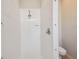 Bathroom features a tiled shower with white tiling and fixtures at 4410 Sawgrass Dr, Palm Harbor, FL 34685