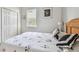 Relaxing bedroom with neutral wall color, closet and cozy bedding at 4410 Sawgrass Dr, Palm Harbor, FL 34685