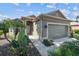Beautiful one-story home with a two-car garage and lush tropical landscaping at 4410 Sawgrass Dr, Palm Harbor, FL 34685