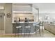 Modern kitchen bar area with sleek countertops and comfortable seating, perfect for entertaining at 4410 Sawgrass Dr, Palm Harbor, FL 34685