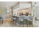 Inviting kitchen bar area with comfortable seating and open access to both the kitchen and living room at 4410 Sawgrass Dr, Palm Harbor, FL 34685