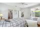 Comfortable main bedroom with access to the patio and en-suite bathroom at 4410 Sawgrass Dr, Palm Harbor, FL 34685