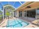 Outdoor patio features an above-ground spa, furniture, and access to the home's interior at 4410 Sawgrass Dr, Palm Harbor, FL 34685