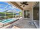 Outdoor patio features an above-ground spa, furniture, and access to the home's interior at 4410 Sawgrass Dr, Palm Harbor, FL 34685