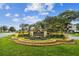 Balintore community entrance sign with colorful landscaping and a welcoming aesthetic at 4410 Sawgrass Dr, Palm Harbor, FL 34685