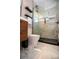 Elegant bathroom featuring a glass shower with marble-style tile and wood vanity at 4430 11Th N Ave, St Petersburg, FL 33713