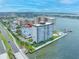 Luxury condo building with waterfront views featuring a community pool, boat dock, and parking at 5220 Brittany S Dr # 1409, St Petersburg, FL 33715