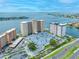 Beautiful aerial view of condo buildings on the water with a beautiful surrounding landscape at 5220 Brittany S Dr # 1409, St Petersburg, FL 33715