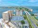 Aerial shot of condo building near the coast with a parking lot and a waterfront view at 5220 Brittany S Dr # 1409, St Petersburg, FL 33715