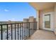 Balcony featuring parking area views and a door leading to interior at 5220 Brittany S Dr # 1409, St Petersburg, FL 33715