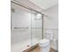 Modern bathroom featuring glass enclosed shower with designer tile and grab bars at 5220 Brittany S Dr # 1409, St Petersburg, FL 33715