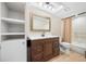 Bathroom featuring dark wood cabinets, white countertops, and tile flooring at 5220 Brittany S Dr # 1409, St Petersburg, FL 33715