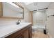 Updated bathroom featuring modern fixtures, vanity, framed mirror and bath tub at 5220 Brittany S Dr # 1409, St Petersburg, FL 33715