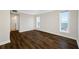 Bedroom showcasing hardwood floors, and bright windows with water views at 5220 Brittany S Dr # 1409, St Petersburg, FL 33715