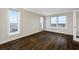 Bright bedroom with hardwood floors, recessed lighting and expansive windows showcasing city views at 5220 Brittany S Dr # 1409, St Petersburg, FL 33715