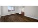 Bedroom featuring wood floors, a large window with city views and an en suite bathroom at 5220 Brittany S Dr # 1409, St Petersburg, FL 33715