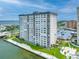 Exterior view of a high-rise waterfront condominium near a sidewalk for residents at 5220 Brittany S Dr # 1409, St Petersburg, FL 33715
