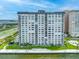 Exterior view of a high-rise condominium by a waterfront access road for residents at 5220 Brittany S Dr # 1409, St Petersburg, FL 33715