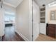 Hallway leading to bedroom featuring wood floors and natural light at 5220 Brittany S Dr # 1409, St Petersburg, FL 33715