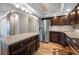 Kitchen with stainless steel refrigerator, modern cabinets, and stone countertops at 5220 Brittany S Dr # 1409, St Petersburg, FL 33715