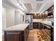 Kitchen features stainless appliances, island with seating, and modern lighting fixtures at 5220 Brittany S Dr # 1409, St Petersburg, FL 33715