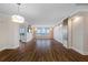 Bright and airy living room with hardwood floors and a large window with a scenic view at 5220 Brittany S Dr # 1409, St Petersburg, FL 33715
