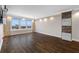 Open living room with hardwood floors, recessed lighting, and large windows showcasing city views at 5220 Brittany S Dr # 1409, St Petersburg, FL 33715