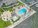 Aerial view of the community pool, cabanas, and dock with access to the waterfront at 5220 Brittany S Dr # 1409, St Petersburg, FL 33715