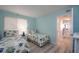 Bright bedroom featuring twin beds, light blue walls, and wood-look floors at 5279 Isla Key S Blvd # 313, St Petersburg, FL 33715