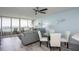 Bright living room with floor-to-ceiling windows and balcony access, modern furnishings, and ocean views at 5279 Isla Key S Blvd # 313, St Petersburg, FL 33715