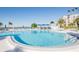 Outdoor swimming pool with lounge chairs and tropical landscaping at 5279 Isla Key S Blvd # 313, St Petersburg, FL 33715