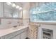 Bright bathroom featuring white vanity, stylish fixtures, and natural light at 536 63Rd S Ave, St Petersburg, FL 33705