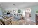 Inviting living room featuring neutral paint, modern furniture, and seamless flow into the kitchen at 536 63Rd S Ave, St Petersburg, FL 33705