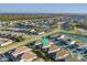 An aerial view of a neighborhood with ponds and green spaces showcases the community at 5807 Silver Sun Dr, Apollo Beach, FL 33572