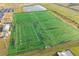 Aerial shot of a sports field lined for American Football with a parking lot and water feature nearby at 5807 Silver Sun Dr, Apollo Beach, FL 33572