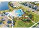 This aerial photo highlights a community pool, playground, and landscaped common areas at 5807 Silver Sun Dr, Apollo Beach, FL 33572