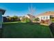 Expansive backyard with lush green grass and manicured landscaping at 5807 Silver Sun Dr, Apollo Beach, FL 33572