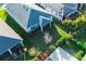 Aerial shot of a lush backyard with verdant lawn, landscaping, and fencing at 5807 Silver Sun Dr, Apollo Beach, FL 33572