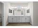 Bright bathroom with double vanity, ample lighting, and shaker cabinets at 5807 Silver Sun Dr, Apollo Beach, FL 33572