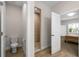 Bathroom featuring tile floors, toilet and glass-enclosed shower stall at 5807 Silver Sun Dr, Apollo Beach, FL 33572